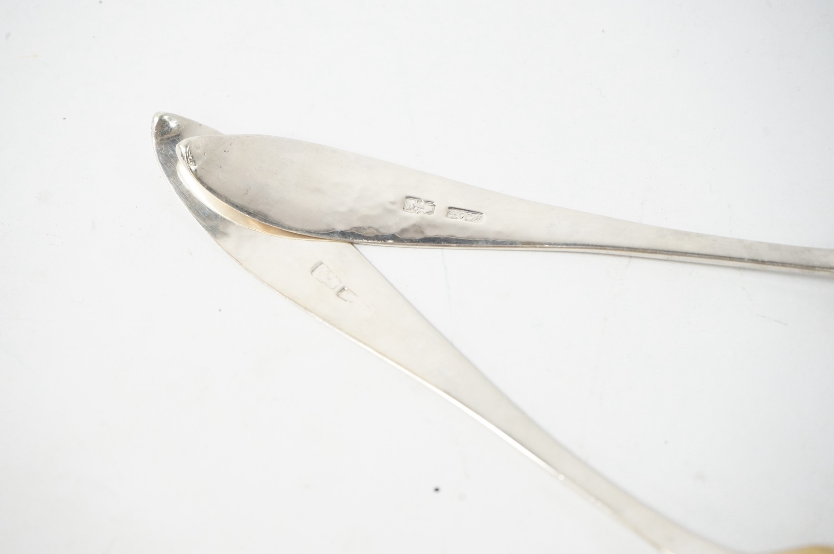 A pair of late 18th/early 19th century German parcel gilt white metal Celtic tip berry spoons, with engraved foliate decoration, maker's mark WHG? in italic, stamped with rampant lion below 13 probably Heidelberg city ma
